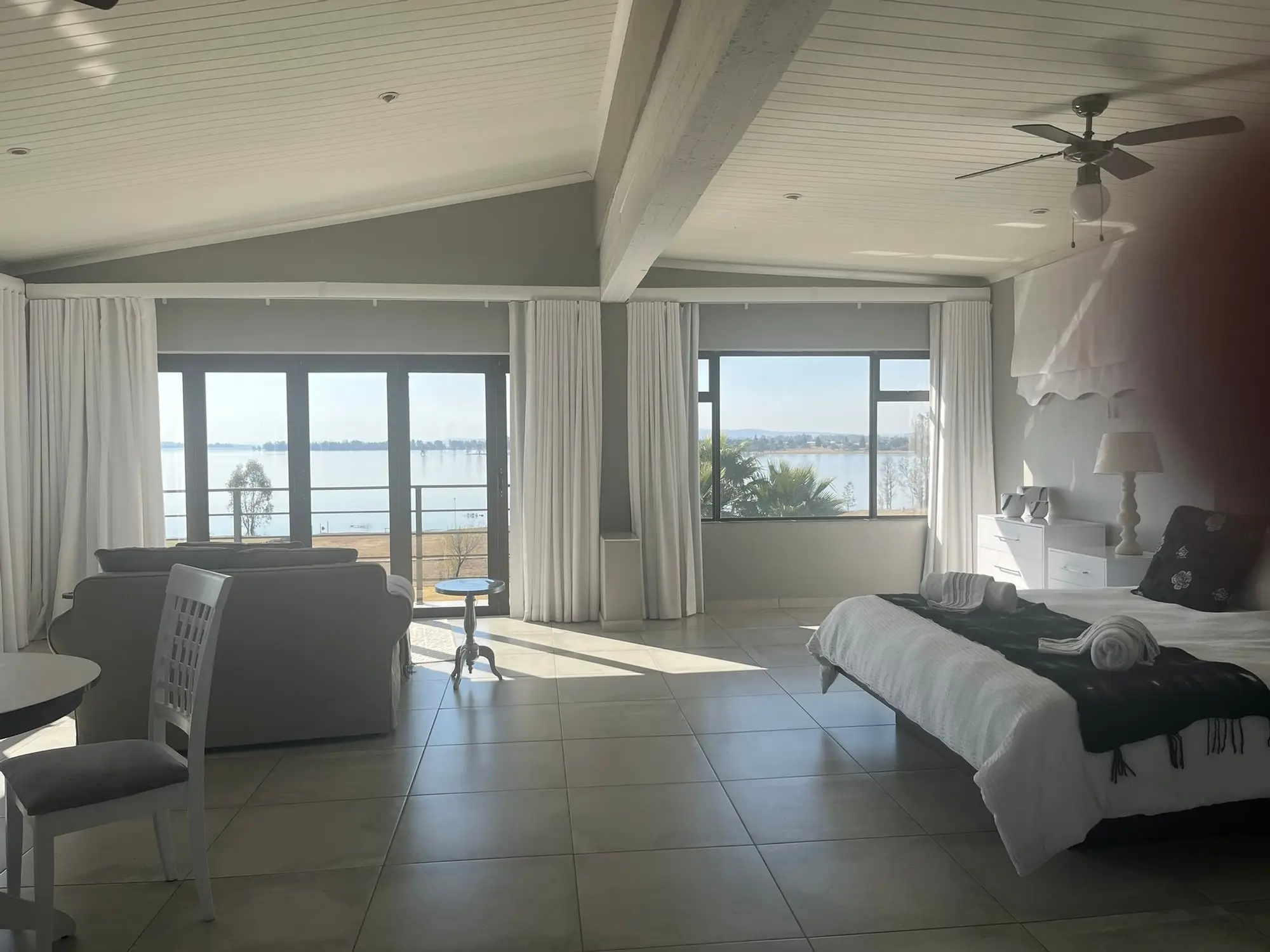 The Owl Room suite looking out over the Vaal Dam through wide windows